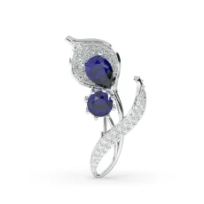 Brosa model floral din aur cu safir si diamante de 0.90ct